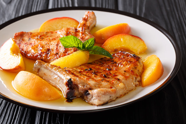 Pork Chops with Spicy Peach Maple Bourbon Pan Sauce